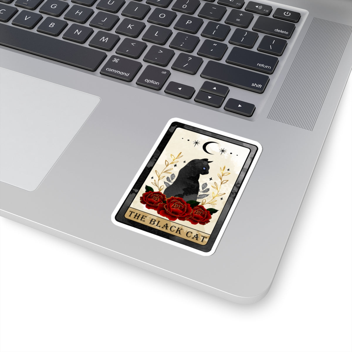 Sticker of 'The Black Cat' tarot card on a laptop