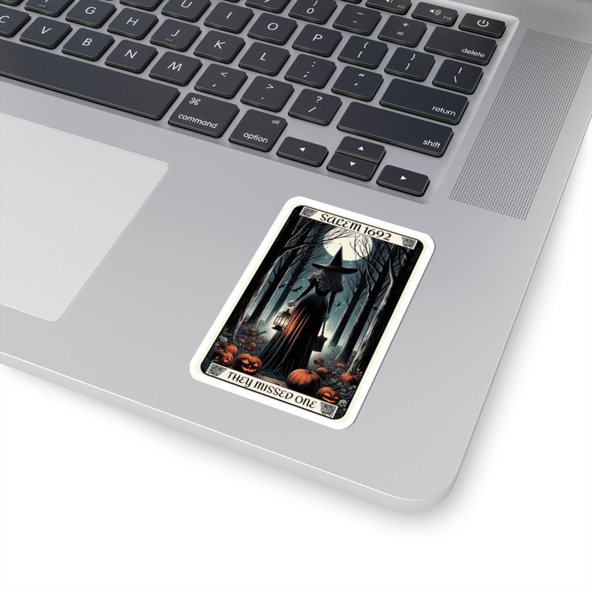 Halloween-themed card on a laptop keyboard
