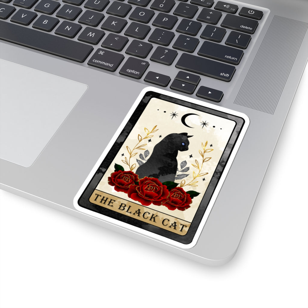 Decorative sticker with a black cat and roses on a laptop keyboard