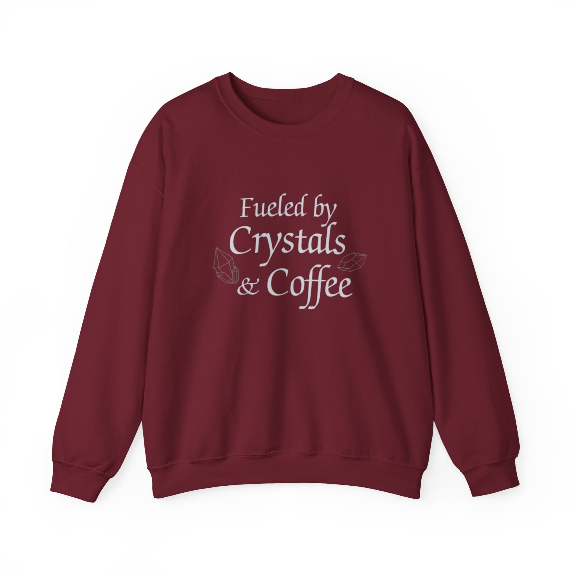 Maroon sweatshirt with 'Fueled by Crystals & Coffee' text on a white background