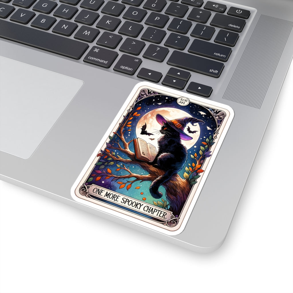 Card with a black cat in a Halloween costume on a laptop