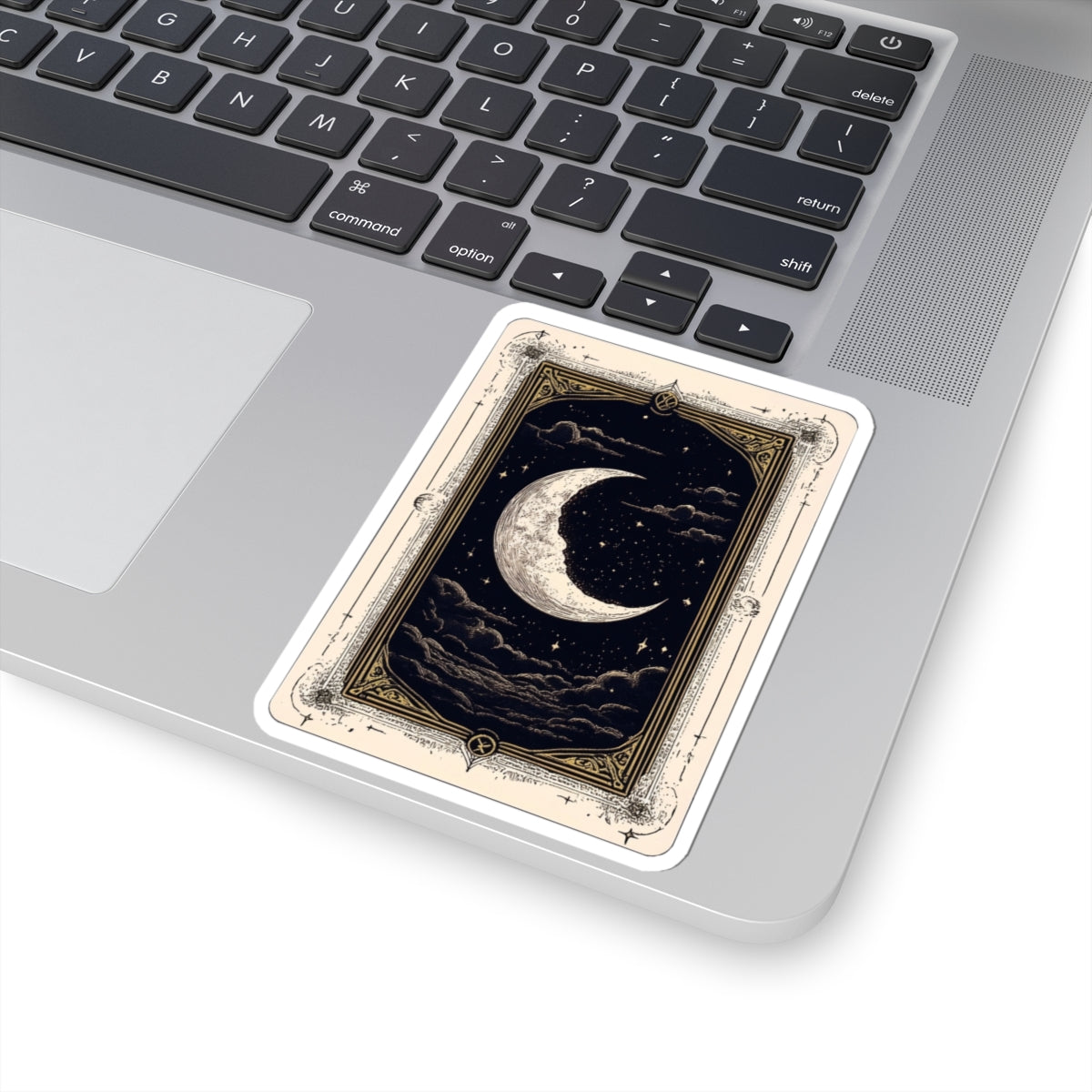 Decorative mouse pad with celestial design on a laptop