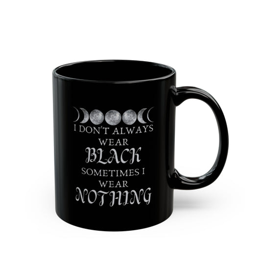 Black mug with white text and moon phases design on a white background